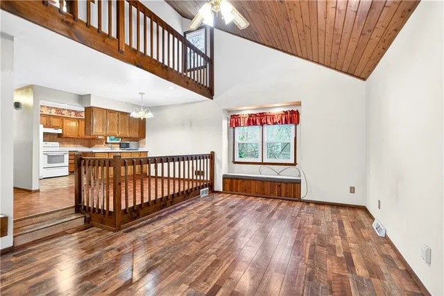 a living room with furniture a fireplace and a table