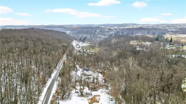 a view of wooden fence and a backyard