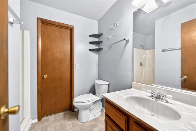 a kitchen with a refrigerator a stove a sink and cabinets