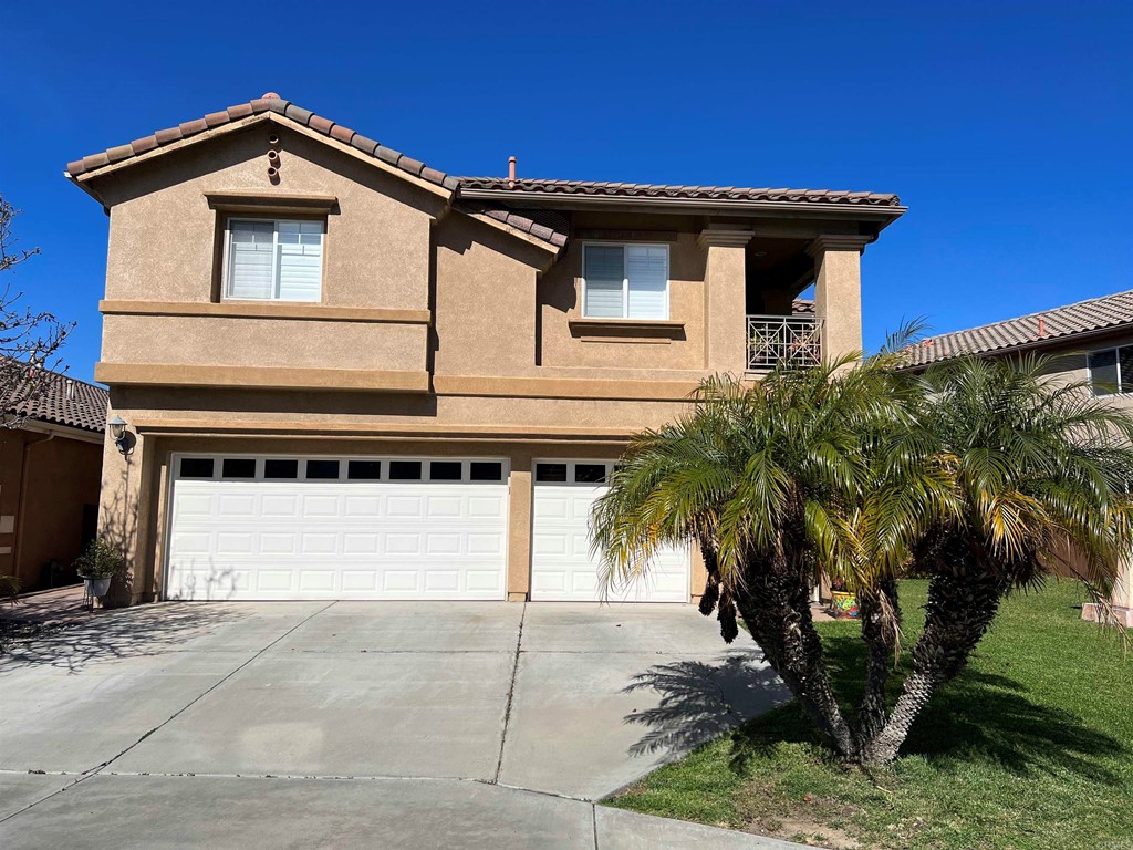 1376 Riviera Summit Road San Diego, CA 92154 - Photo 1 of 1 a view of a house with a small yard and plants