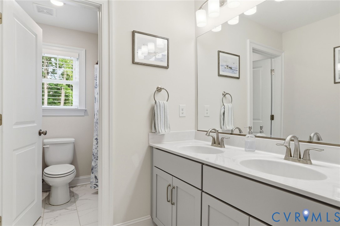12040 Kenton Ridge Road Ashland, VA 23005 - Photo 31 of 54 Dual vanity with light gray cabinetry and brushed