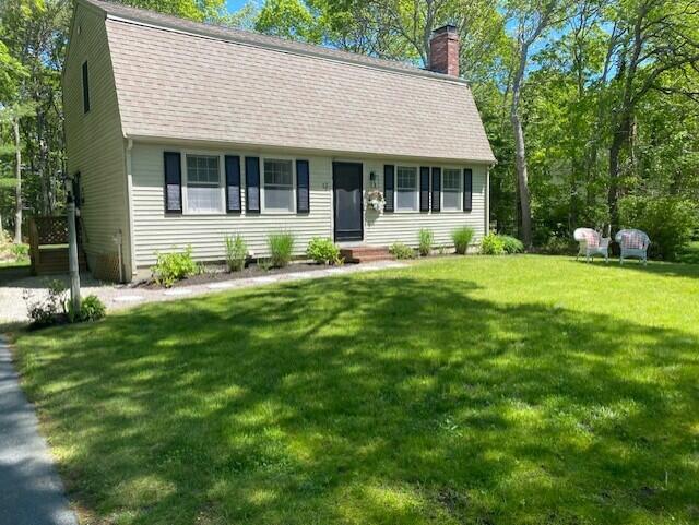 12 Pinehurst Drive Monument Beach, MA 02532 - Photo 1 of 31 a front view of a house with a garden and porch