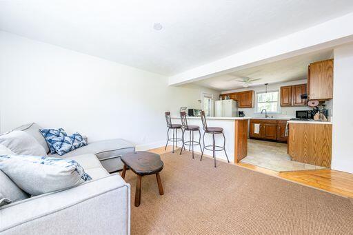 12 Pinehurst Drive Monument Beach, MA 02532 - Photo 16 of 31 a living room with furniture and a kitchen view