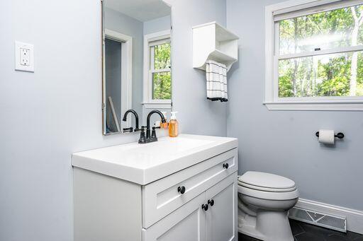 12 Pinehurst Drive Monument Beach, MA 02532 - Photo 20 of 31 a bathroom with a sink a toilet and a window