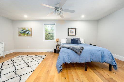 12 Pinehurst Drive Monument Beach, MA 02532 - Photo 22 of 31 a bedroom with a bed and a painting on the wall