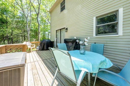 12 Pinehurst Drive Monument Beach, MA 02532 - Photo 7 of 31 a view of a patio with table and chairs