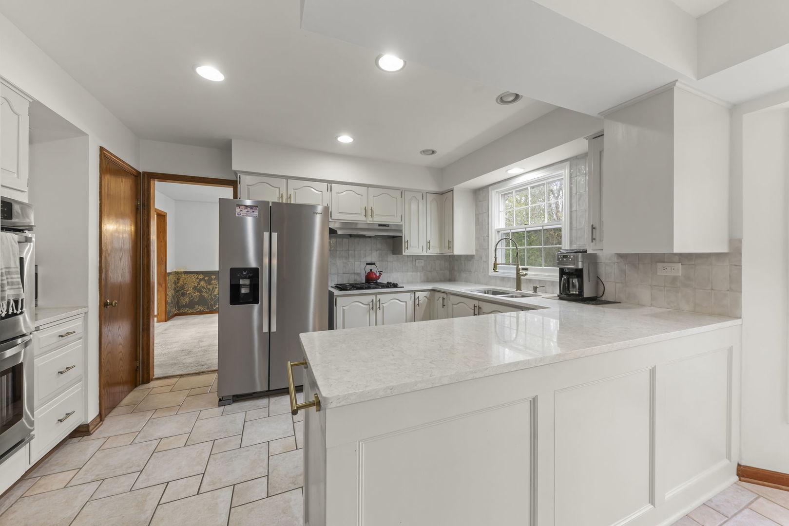1150 Nottingham Lane Elgin, IL 60120 - Photo 11 of 33 a large kitchen with stainless steel appliances a refrigerator sink and cabinets