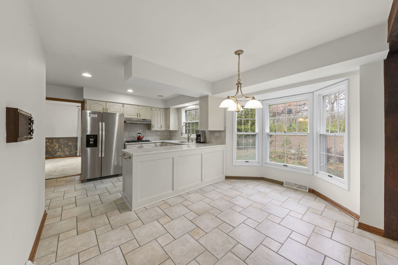 1150 Nottingham Lane Elgin, IL 60120 - Photo 12 of 33 a open kitchen with white cabinets and refrigerator