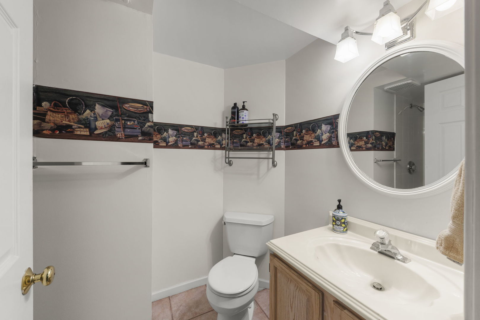 1150 Nottingham Lane Elgin, IL 60120 - Photo 33 of 33 a bathroom with a sink a toilet and a mirror