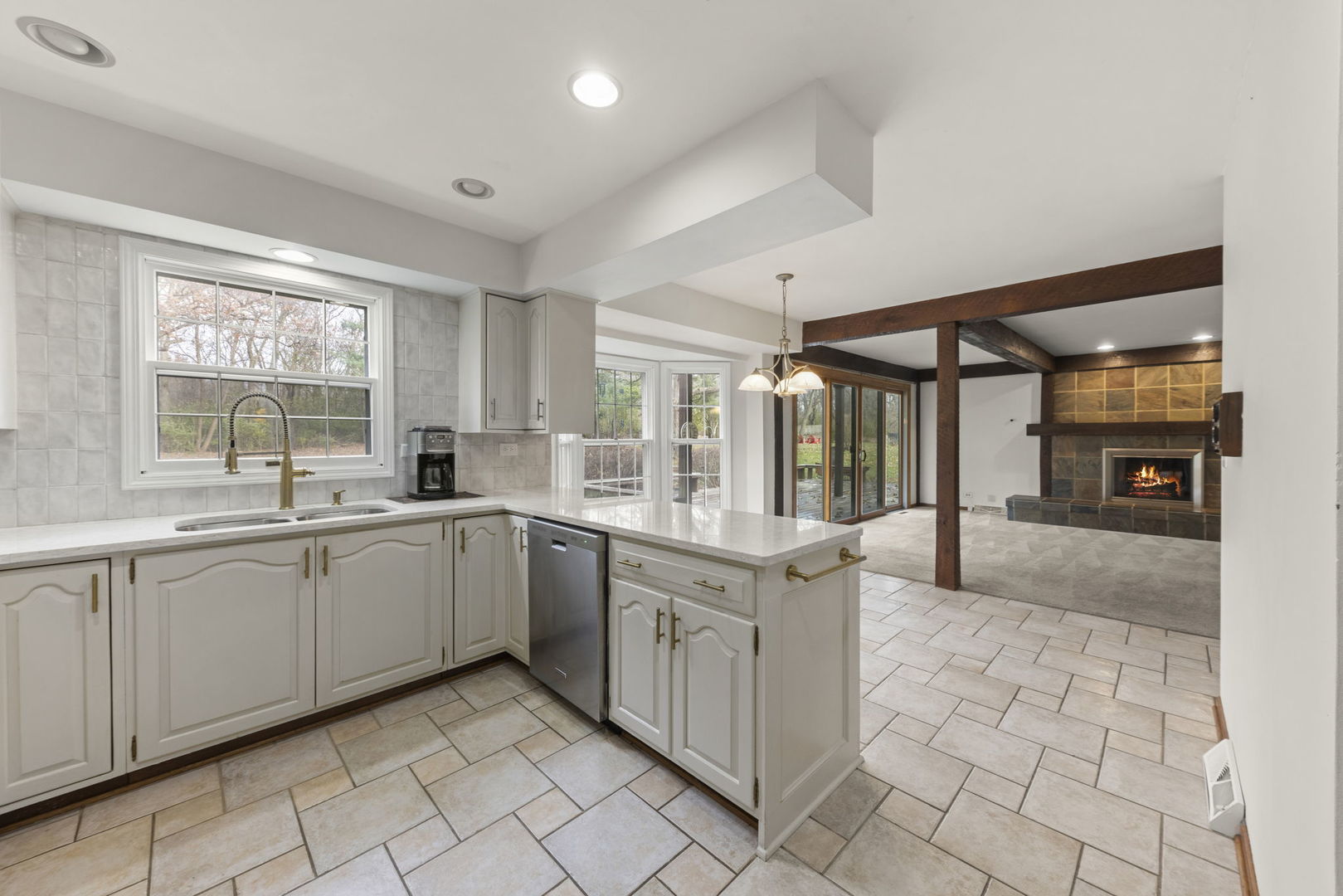 1150 Nottingham Lane Elgin, IL 60120 - Photo 9 of 33 a large white kitchen with a large window