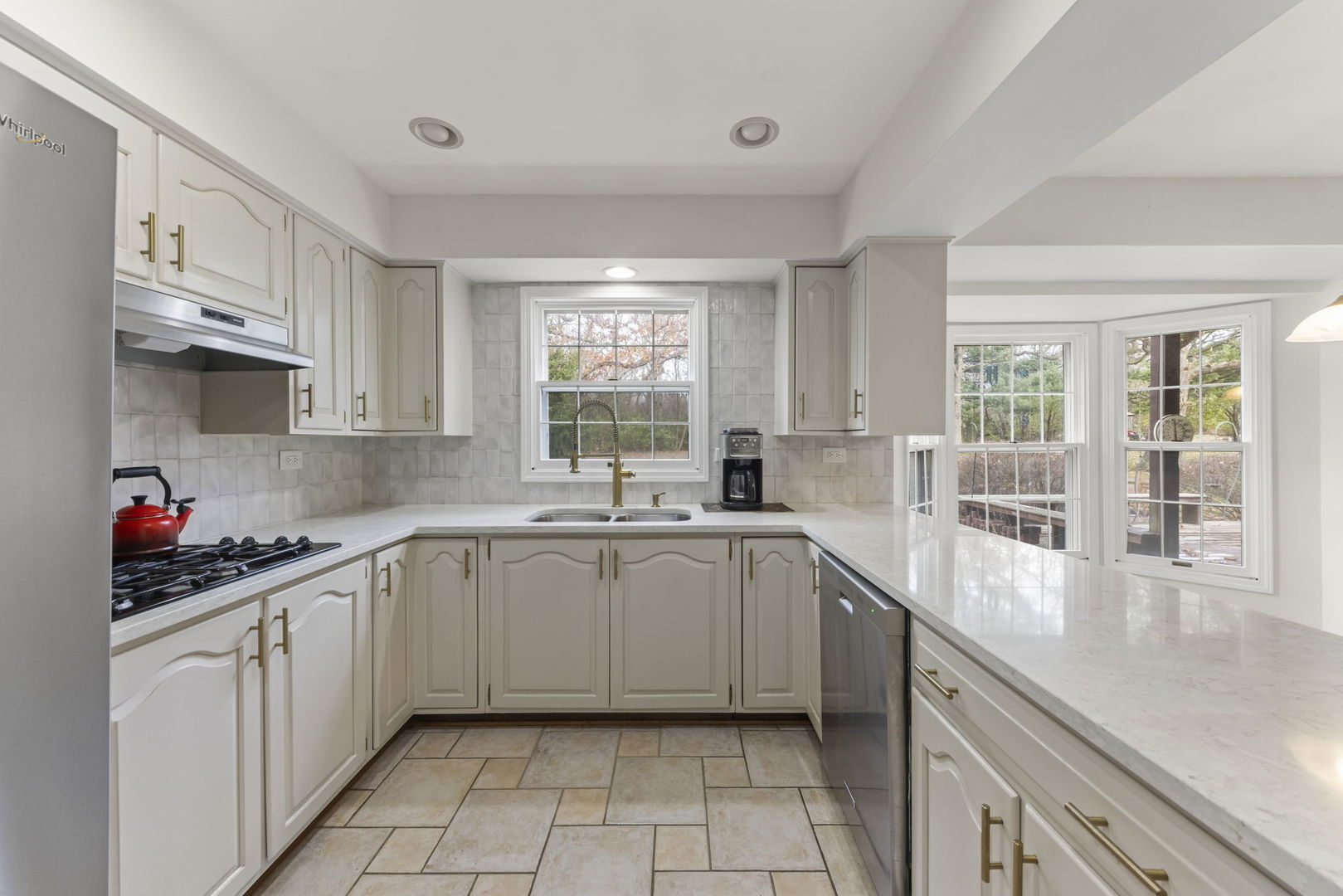 1150 Nottingham Lane Elgin, IL 60120 - Photo 10 of 33 a kitchen with a sink cabinets and window