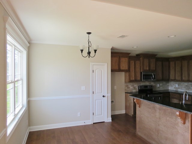 904 Rainbow Springs Road Macon, GA 31216 - Photo 11 of 16 a kitchen with stainless steel appliances granite countertop a refrigerator and a sink