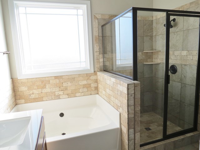 904 Rainbow Springs Road Macon, GA 31216 - Photo 16 of 16 a bathroom with a bathtub and shower
