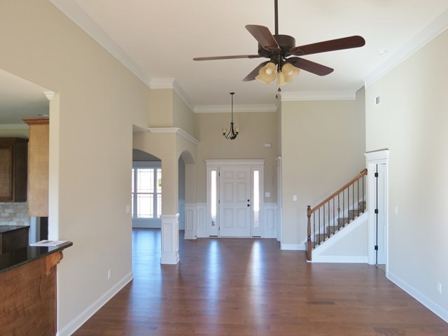 904 Rainbow Springs Road Macon, GA 31216 - Photo 4 of 16 a view of a livingroom with wooden floor and a ceiling fan