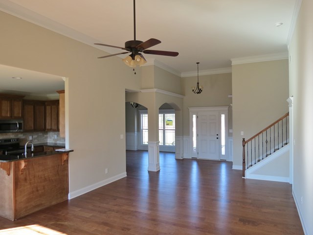 904 Rainbow Springs Road Macon, GA 31216 - Photo 5 of 16 a view of empty room with wooden floor and fan