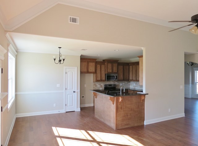 904 Rainbow Springs Road Macon, GA 31216 - Photo 9 of 16 a kitchen with stainless steel appliances granite countertop a refrigerator and a sink