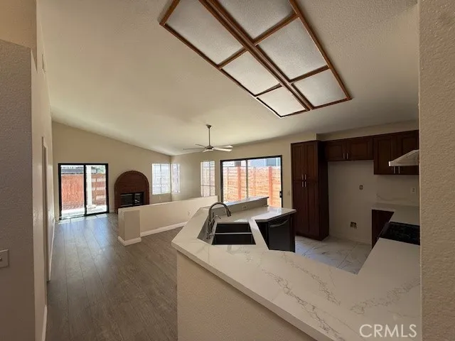 a large white kitchen with a large window