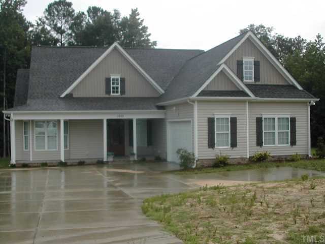 2458 Mitchell Road Angier, NC 27501 - Photo 1 of 6 a front view of a house with a yard