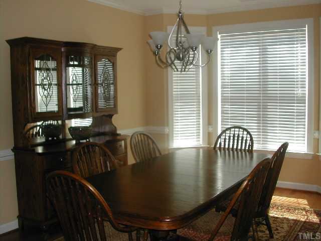 2458 Mitchell Road Angier, NC 27501 - Photo 3 of 6 a view of a dining room with furniture and chandelier