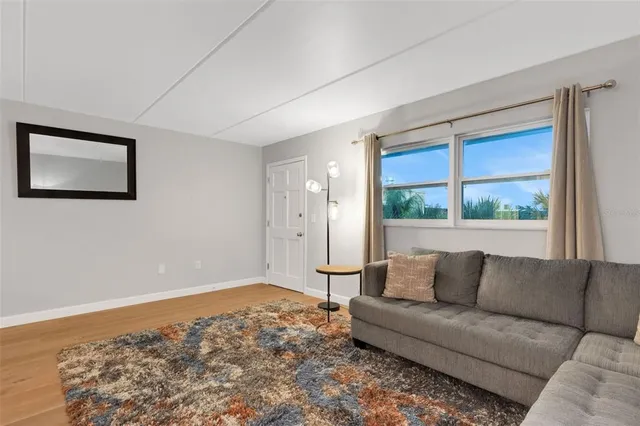 a living room with a couch and a large window