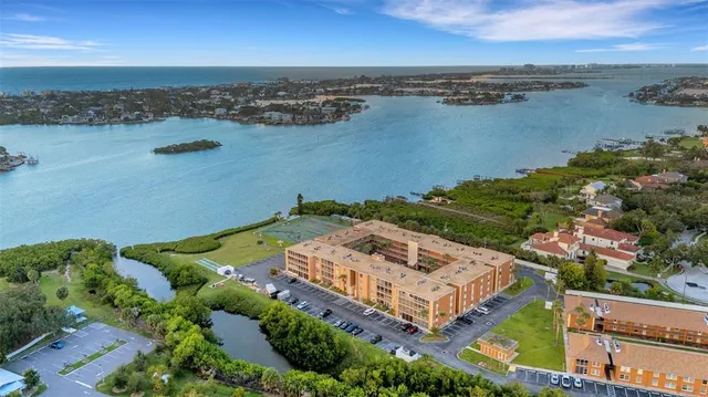 an aerial view of a house with a lake view