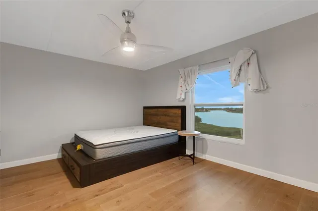 a bedroom with a bed and window