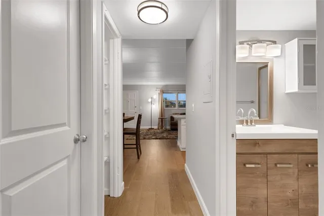 a bathroom with a sink toilet mirror and shower