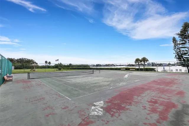 a view of a backyard with sitting area