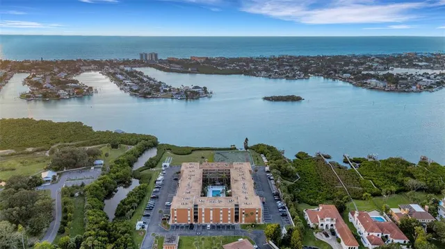 an aerial view of a house with a lake view