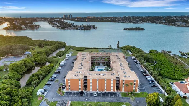 an aerial view of a house with a lake view