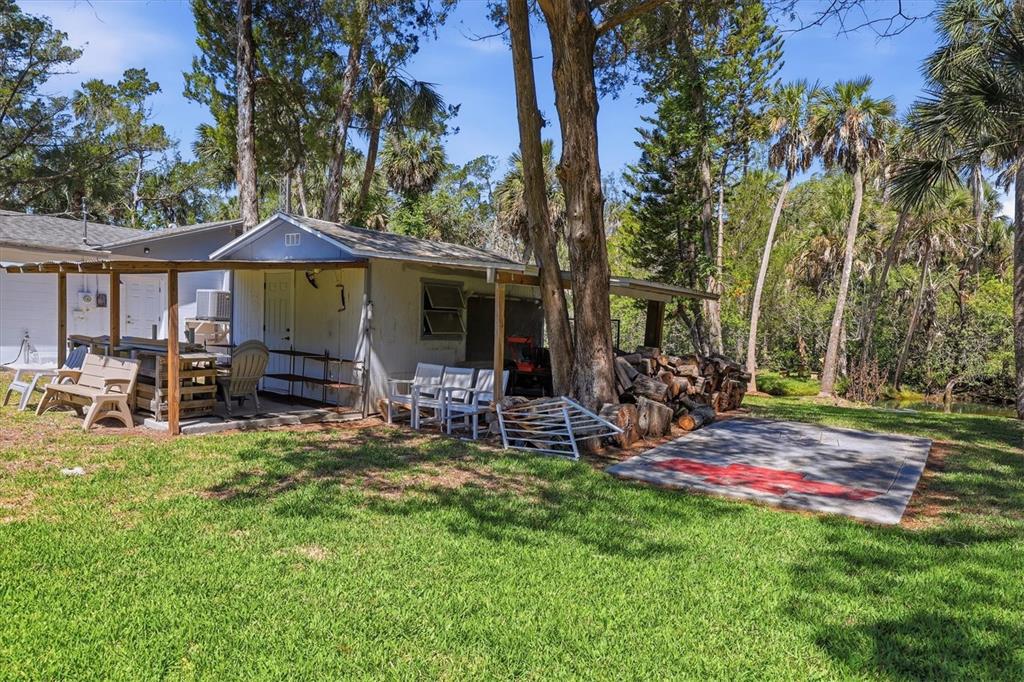 6244 Colony Circle Weeki Wachee, FL 34607 - Photo 12 of 60 a view of a house with backyard