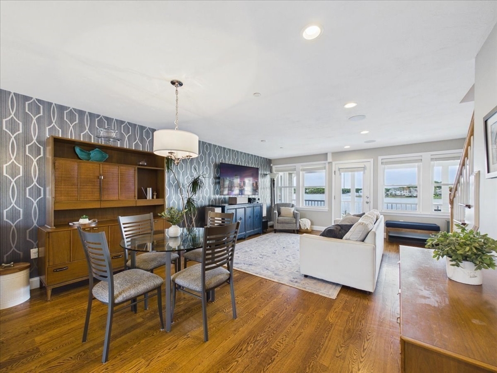 7 Bay Street, Unit 3 Hull, MA 02045 - Photo 6 of 40 a living room with furniture and a chandelier