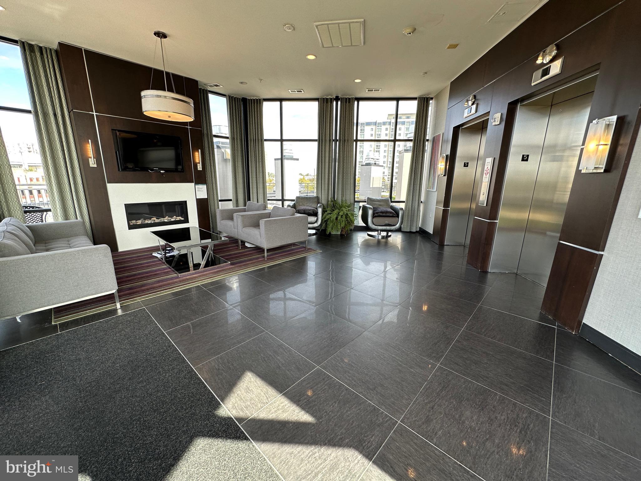 8005 13th Street, Unit 408 Silver Spring, MD 20910 - Photo 15 of 24 a lobby with furniture and window