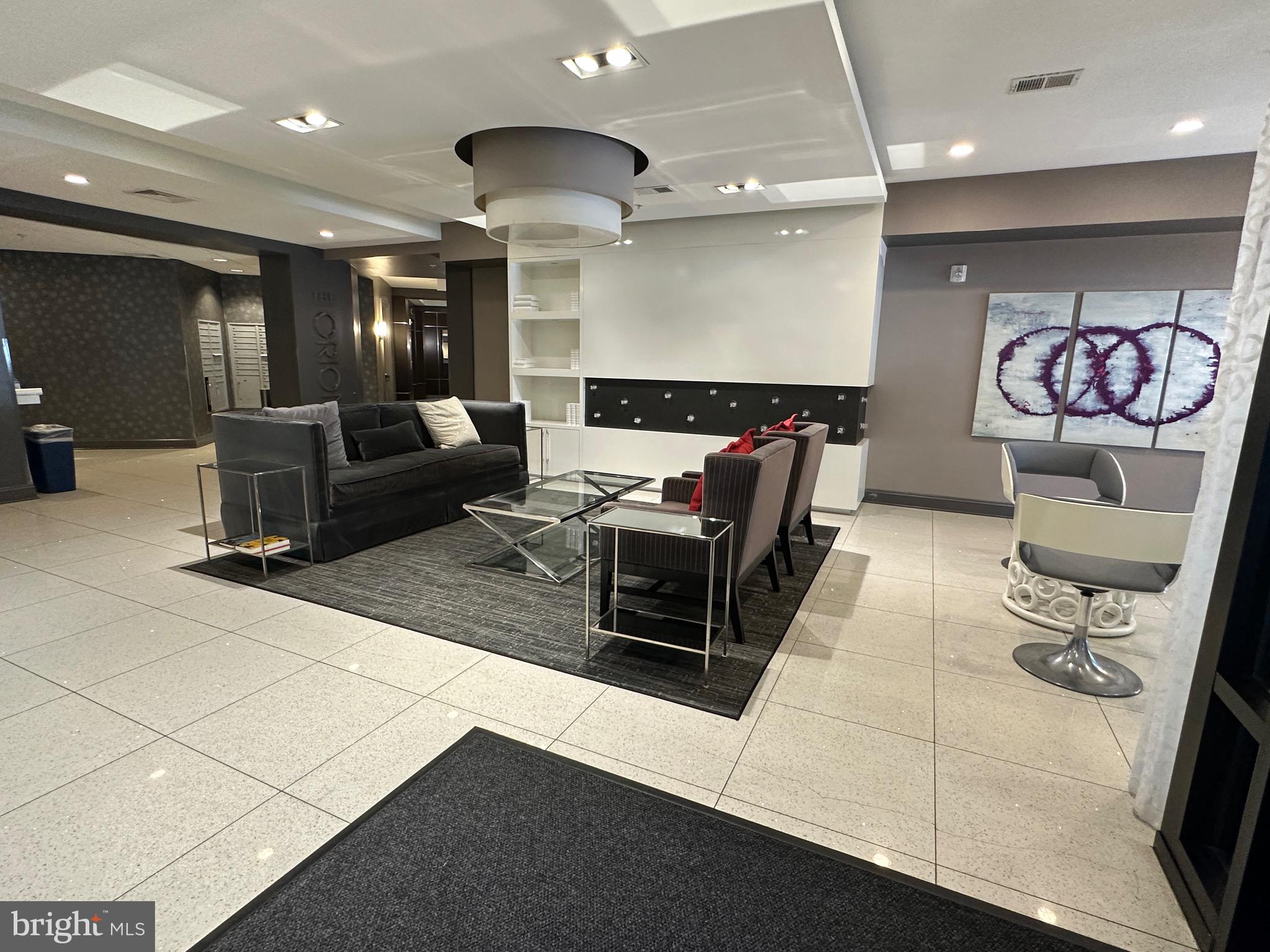 8005 13th Street, Unit 408 Silver Spring, MD 20910 - Photo 20 of 24 a living room with furniture