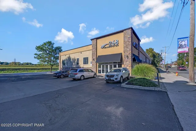 a view of a street with a car parked in front of it