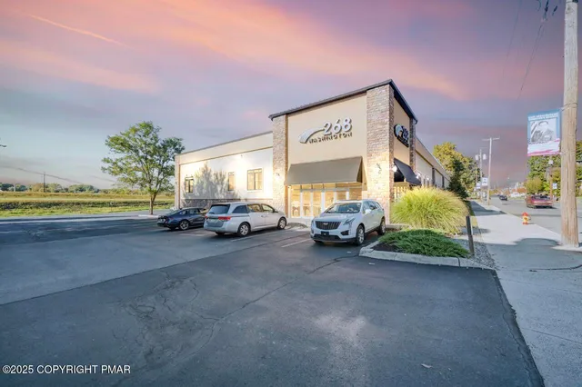 a view of a car park in front of a building
