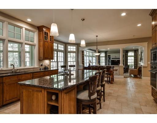 63 Goodnow Road Sudbury, MA 01776 - Photo 13 of 30 a dining hall with stainless steel appliances granite countertop a stove a sink a dining table and chairs