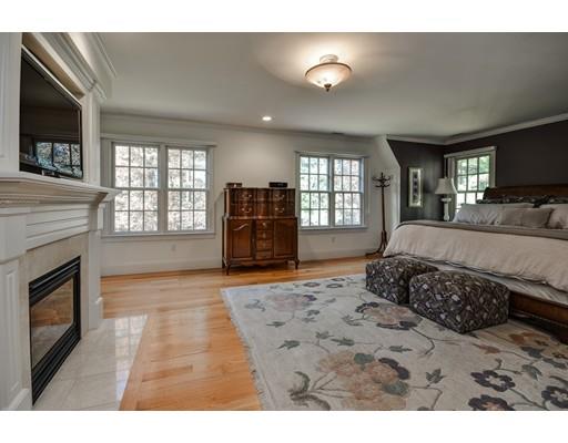 63 Goodnow Road Sudbury, MA 01776 - Photo 18 of 30 a living room with a bed furniture and a flat screen tv