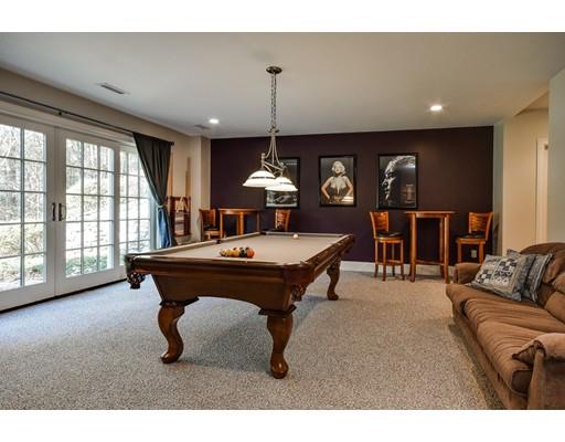 63 Goodnow Road Sudbury, MA 01776 - Photo 26 of 30 a living room with furniture a chandelier and a large window