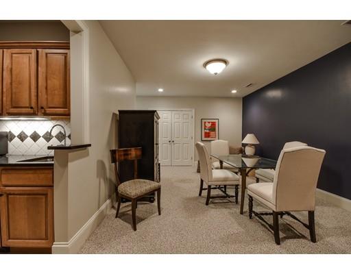 63 Goodnow Road Sudbury, MA 01776 - Photo 27 of 30 a living room with furniture and a flat screen tv