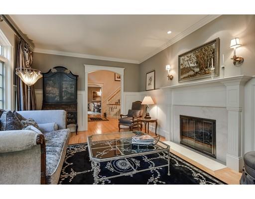 63 Goodnow Road Sudbury, MA 01776 - Photo 5 of 30 a living room with furniture a fireplace and a flat screen tv