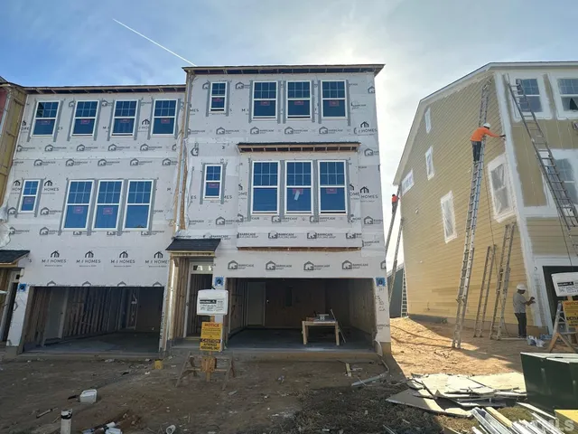 a view of a brick building with many windows