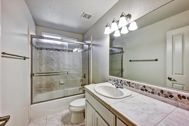 an aerial view of a house with a garden