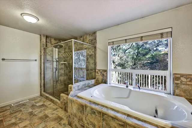 an aerial view of a house with a lake view