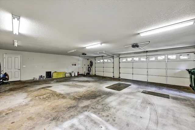 a view of a house with a tree in the background