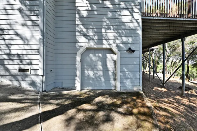 a view of a house with a tree in the background