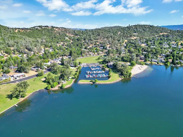 a view of a house with a yard and sitting area