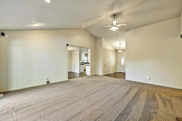 a living room with a fireplace and a flat screen tv