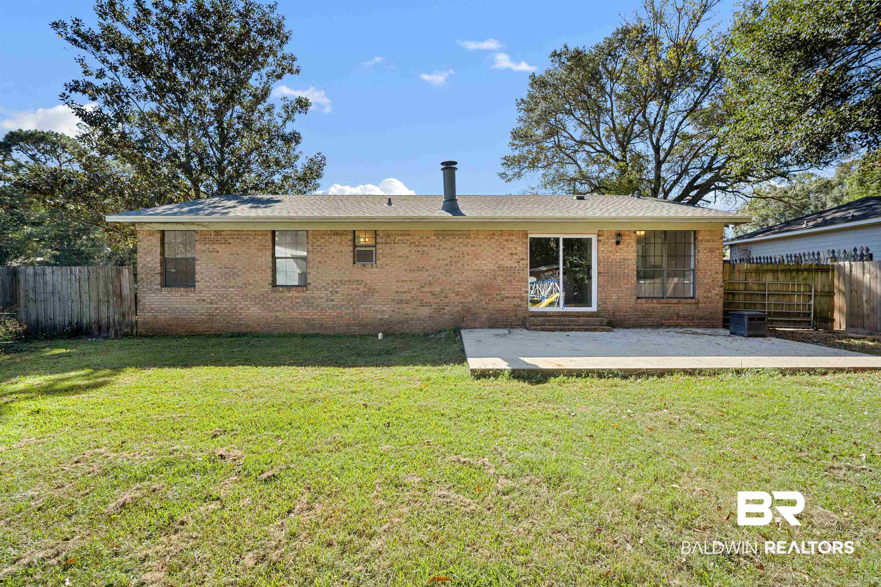 12910 Del Rio Street Grand Bay, AL 36541 - Photo 23 of 26 Rear view of property with brick siding and a patio