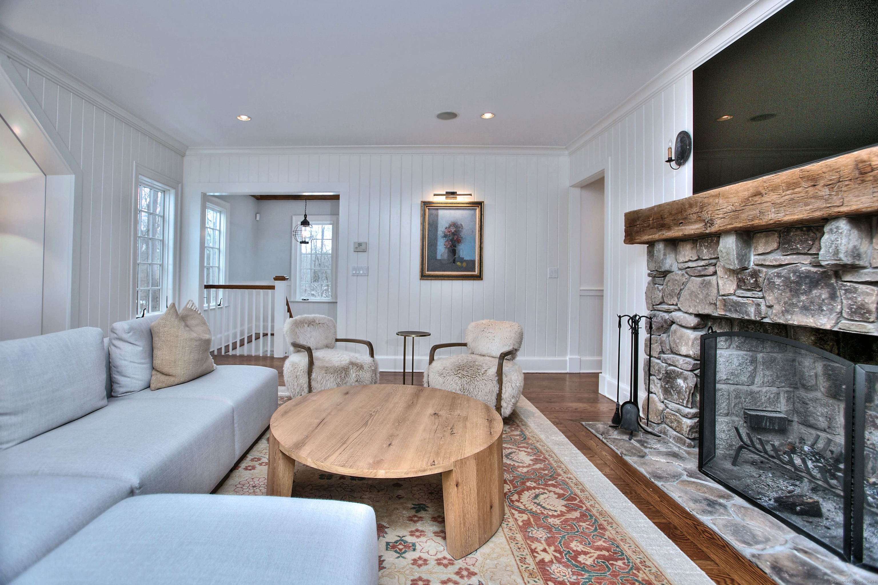 15 Catamount Road Westport, CT 06880 - Photo 16 of 39 a living room with furniture and a fireplace